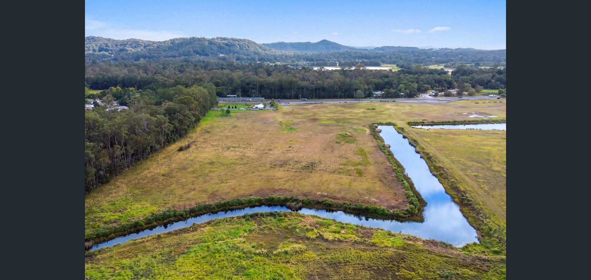 Wide aerial view of the site